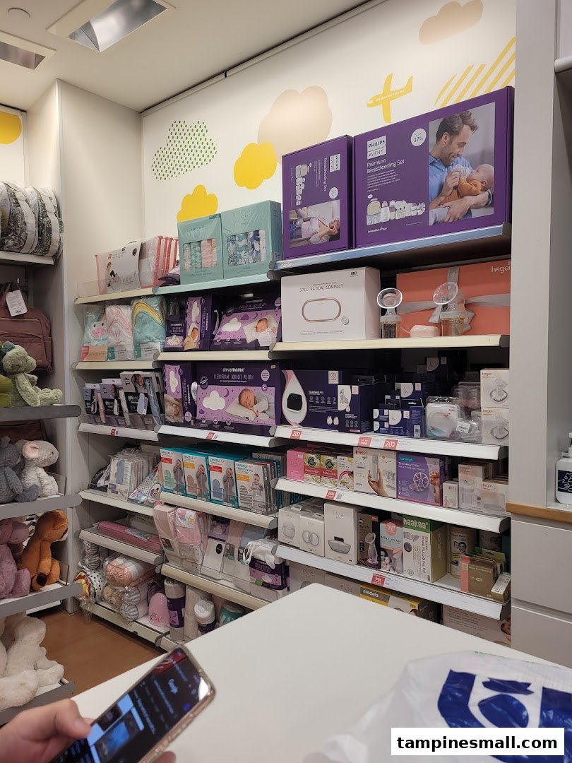 An interior view of Mothercare, showcasing shelves filled with baby products, feeding essentials, and accessories.
