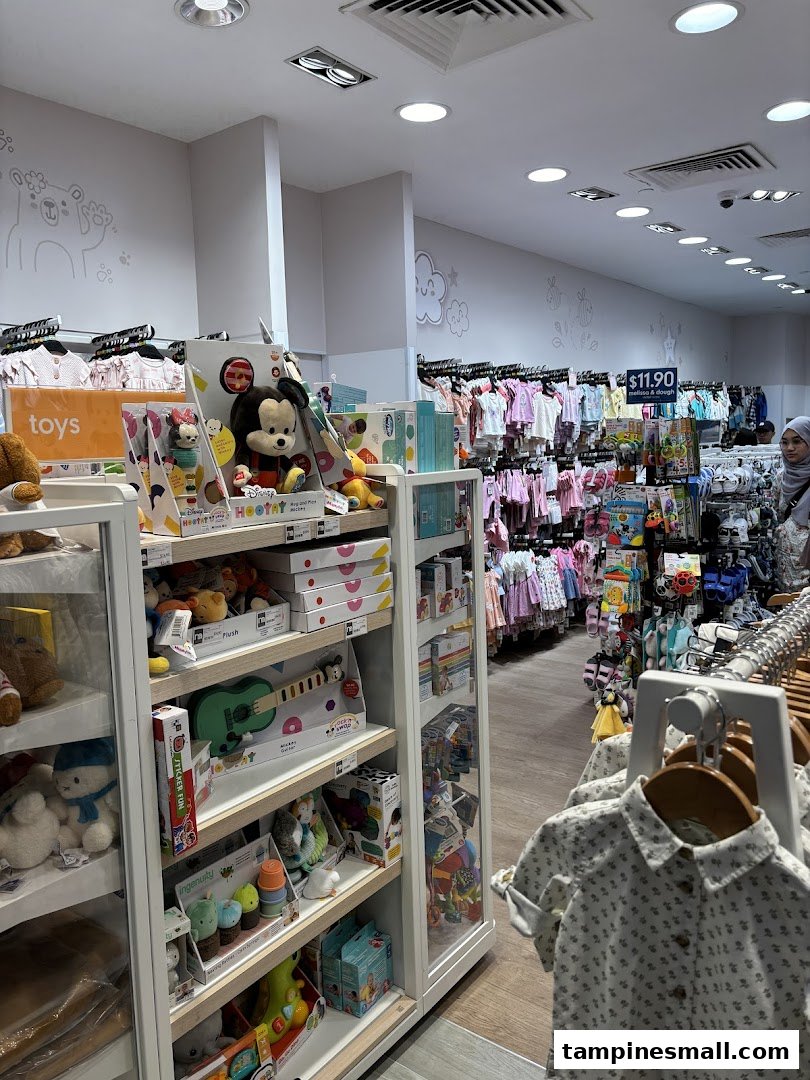 An interior view of Mothercare, showcasing a wide range of baby clothes, toys, and essential products.