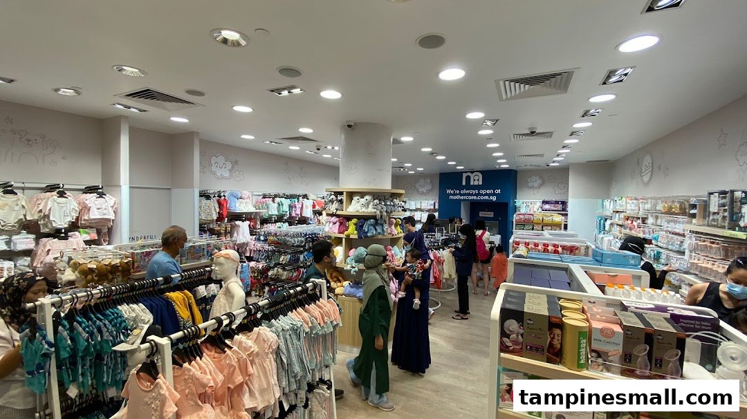 Interior view of Mothercare Tampines Mall with customers browsing baby clothes, toys, and essential products.