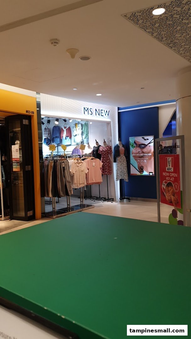 The shop front of Ms New, a women's clothing store, displaying various garments on racks and mannequins.