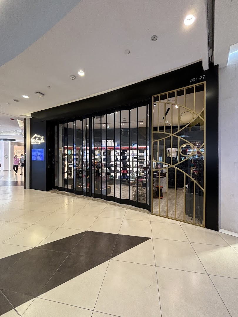 The elegant black and gold shopfront of Mt.Sapola Singapore, showcasing its inviting entrance.