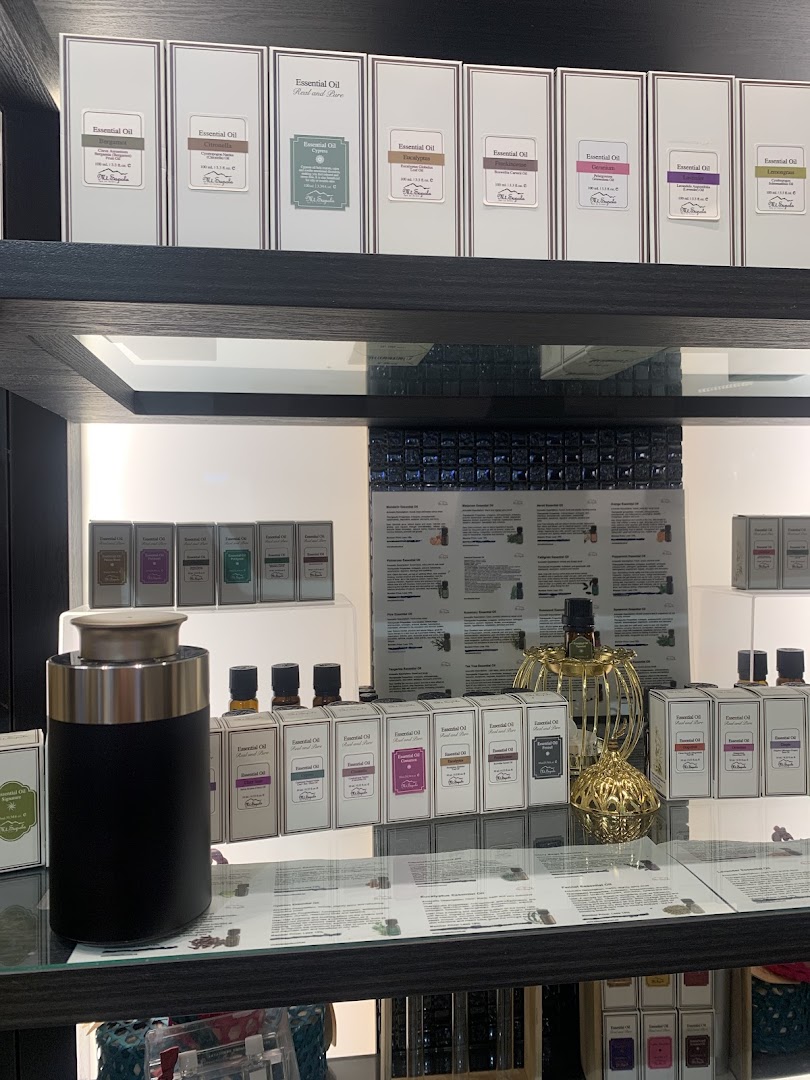 A display of various essential oils and diffusers on shelves in Mt.Sapola Singapore.