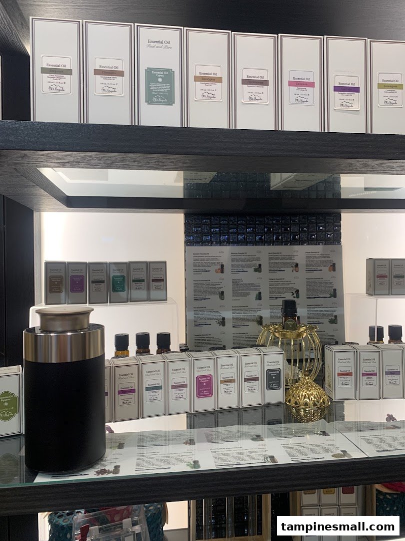 A display of various essential oils and diffusers on shelves in Mt.Sapola Singapore.
