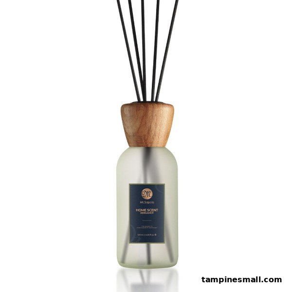 A Mt.Sapola Home Scent Bergamot diffuser with reeds in a frosted glass bottle.