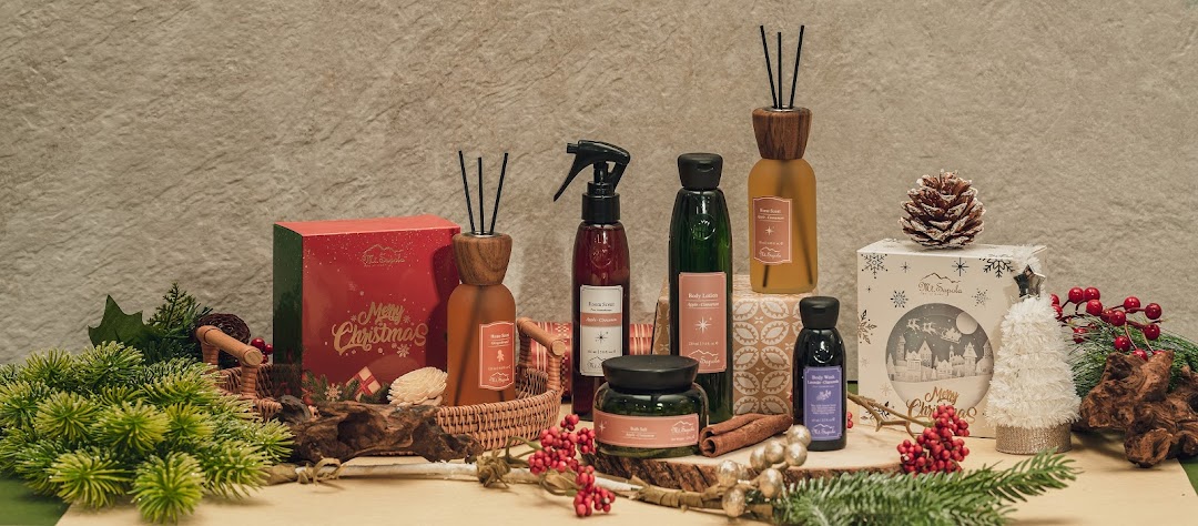 A festive display of Mt.Sapola aromatherapy and body care products with Christmas decorations.
