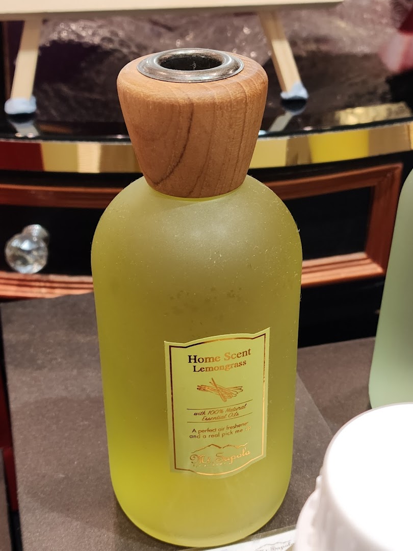 A close-up of a Mt.Sapola Lemongrass Home Scent diffuser bottle with natural essential oils.