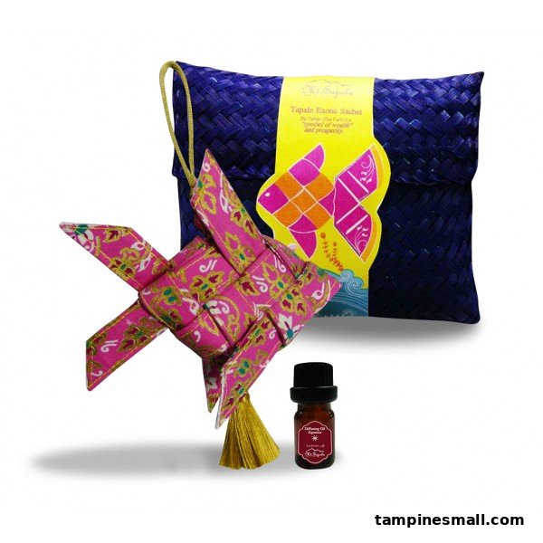 A Mt.Sapola Tapain Exotic Sachet set with a woven fish ornament and a diffusing oil bottle.