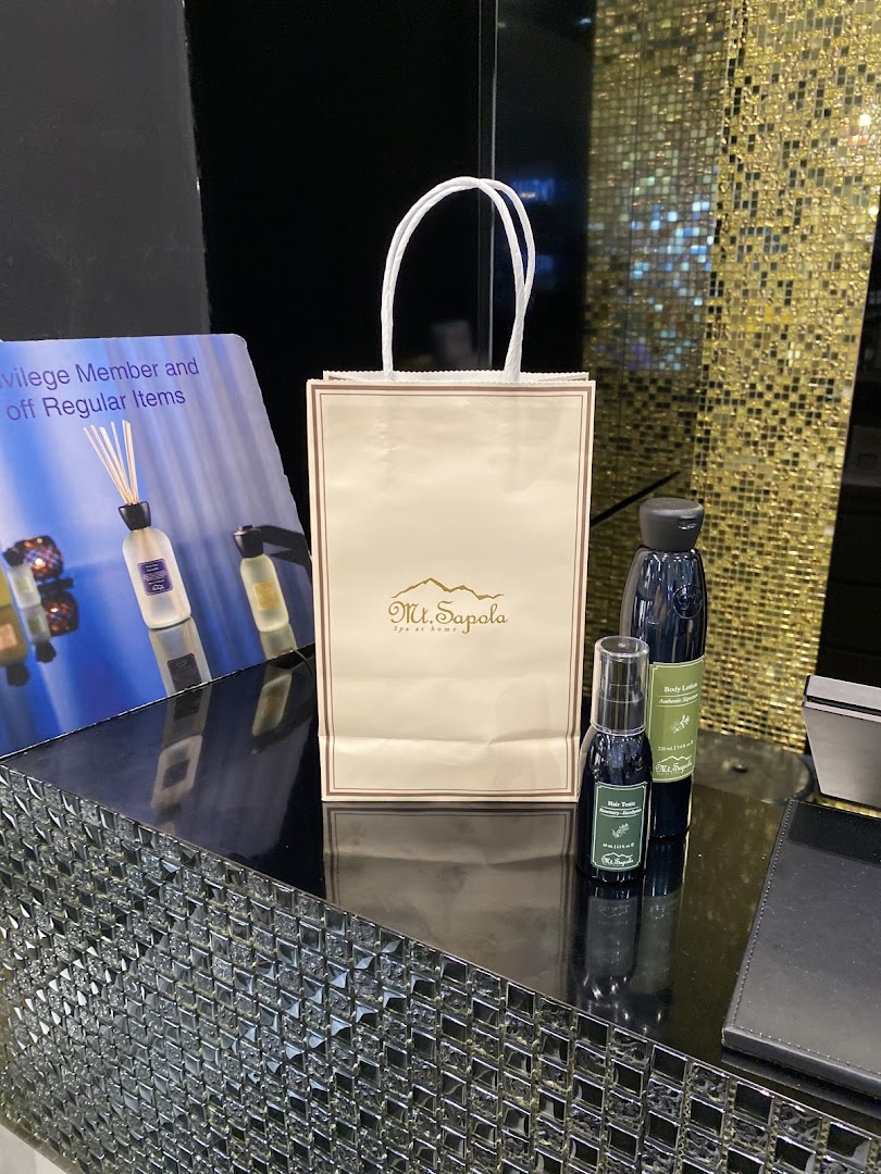 A Mt. Sapola shopping bag and natural body care products displayed on a counter.