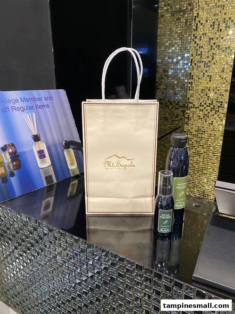 A Mt. Sapola shopping bag and natural body care products displayed on a counter.