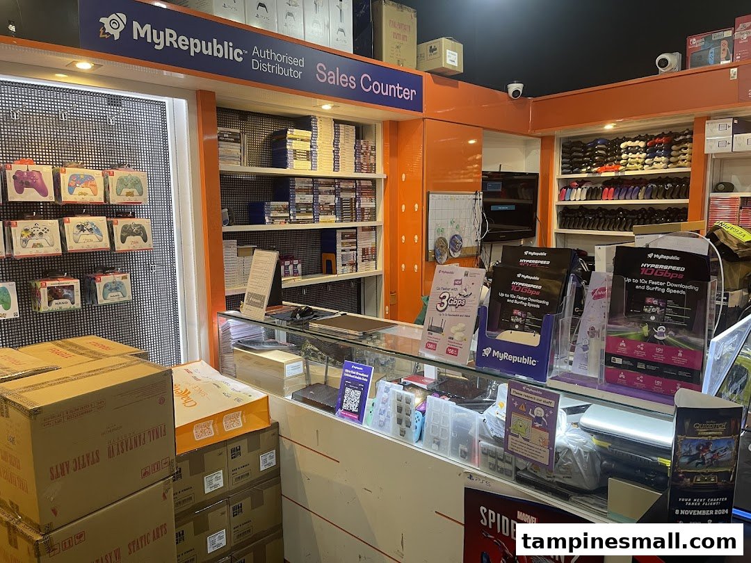 MyRepublic sales counter showcasing gaming products, software, and high-speed internet service promotions.