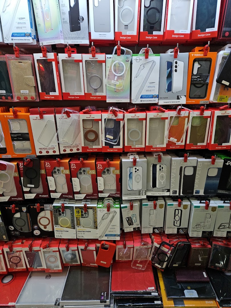A wall display showcasing a wide variety of smartphone cases and accessories for different models.