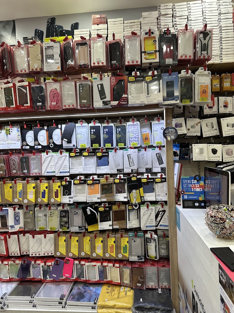 A retail display wall showcasing a wide variety of phone cases and mobile accessories.