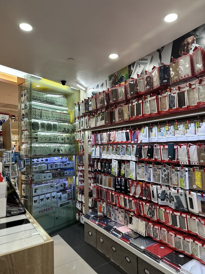 Interior view of a tech accessories shop displaying a wide variety of phone cases and mobile accessories.