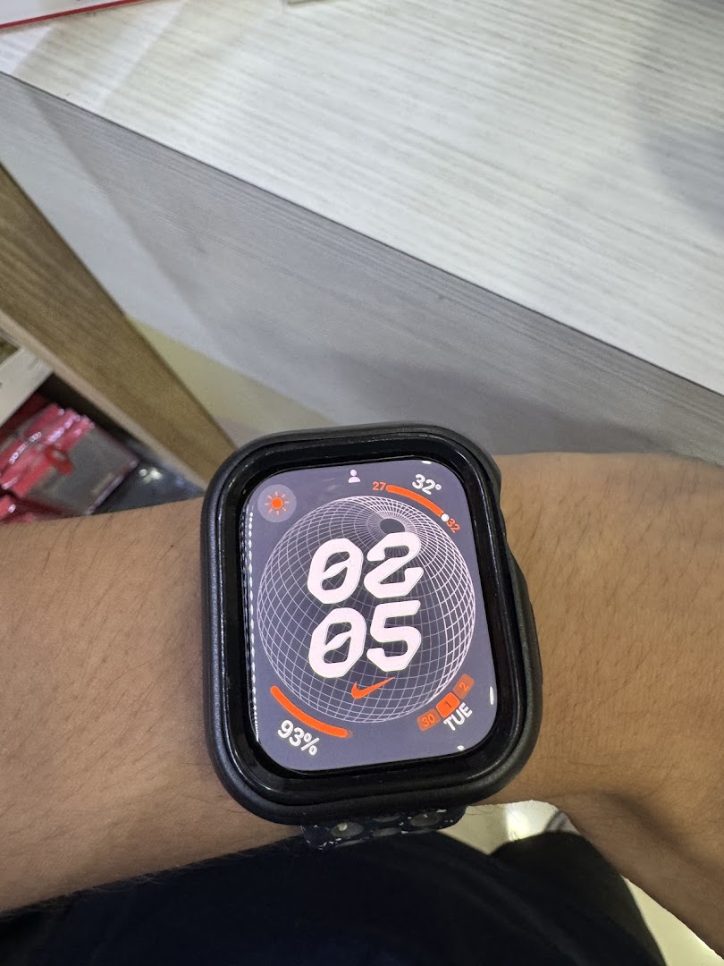 Close-up of a person's wrist wearing an Apple Watch with a Nike watch face.