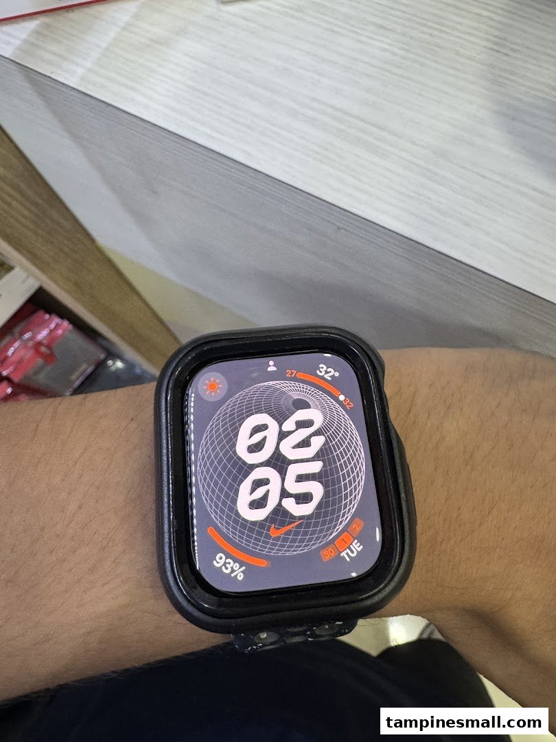 Close-up of a person's wrist wearing an Apple Watch with a Nike watch face.
