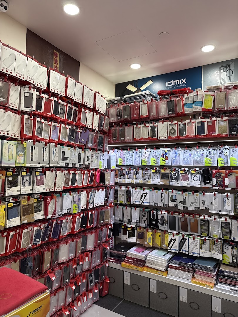 Interior view of a retail shop showcasing a vast collection of phone cases and mobile accessories on display.