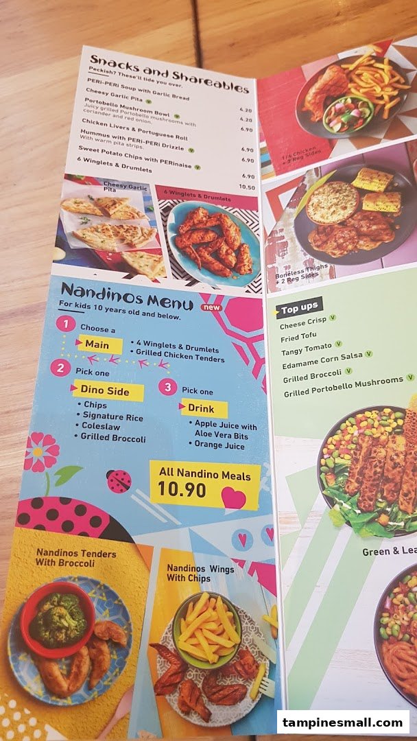 A detailed view of Nandos' menu, featuring snacks, shareables, and the kids' Nandinos menu.