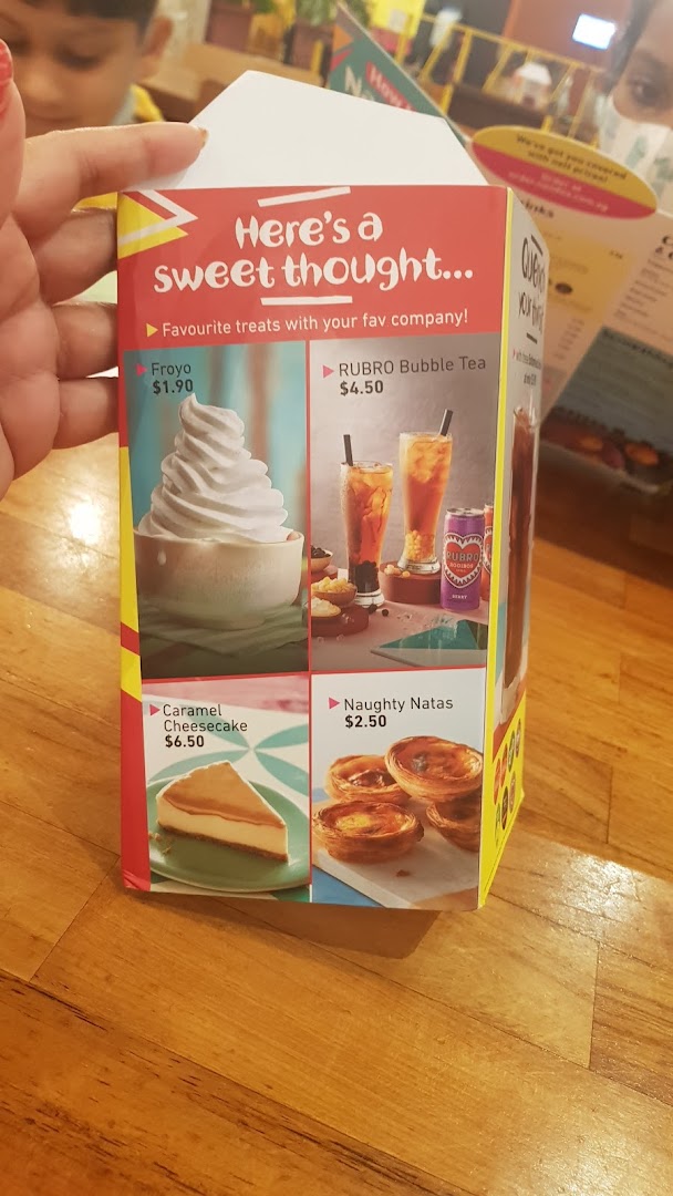 A Nando's menu displaying sweet treats, including Froyo, bubble tea, cheesecake, and natas.