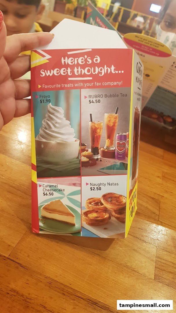 A Nando's menu displaying sweet treats, including Froyo, bubble tea, cheesecake, and natas.