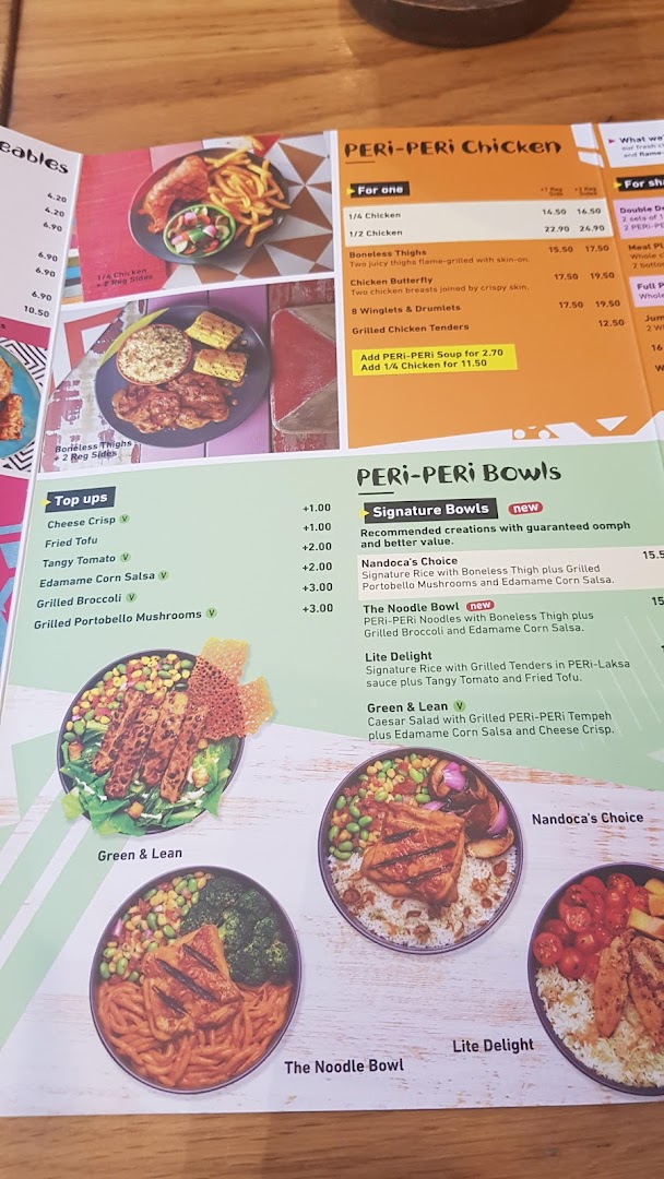 A detailed view of Nando's PERi-PERi chicken and bowls menu.
