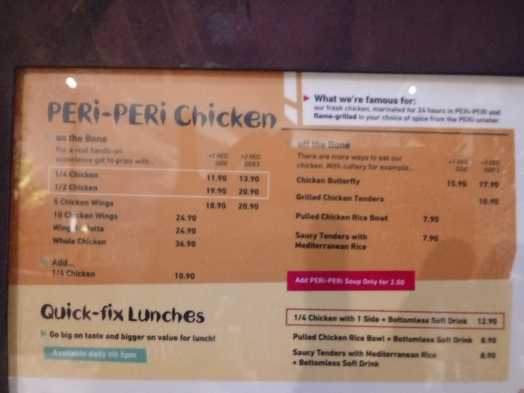 A detailed menu board displaying Nando's PERi-PERi chicken dishes and prices.