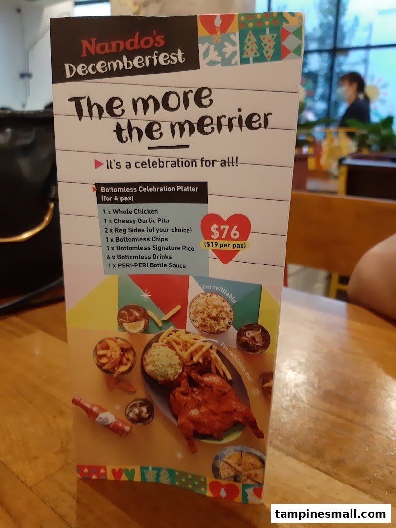 A Nando's Decemberfest menu displaying a 'Bottomless Celebration Platter' for four people.