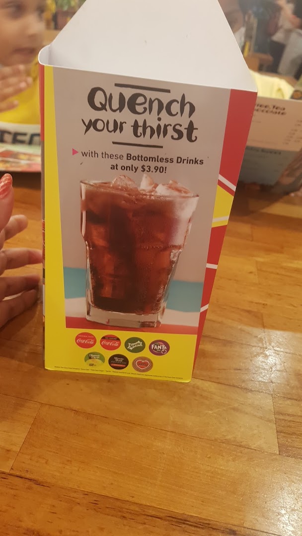 A table-top display advertising Nando's bottomless drinks for $3.90.