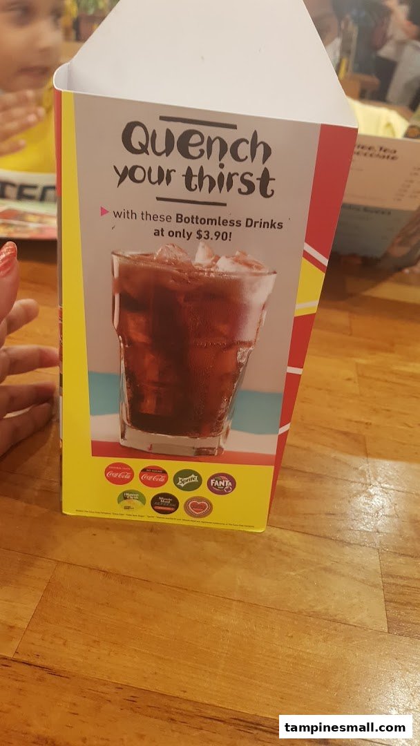 A table-top display advertising Nando's bottomless drinks for $3.90.