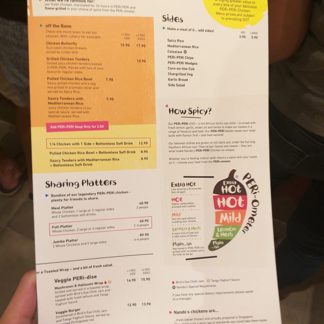 A detailed view of the Nando's menu, showcasing chicken, sides, platters, and spice levels.