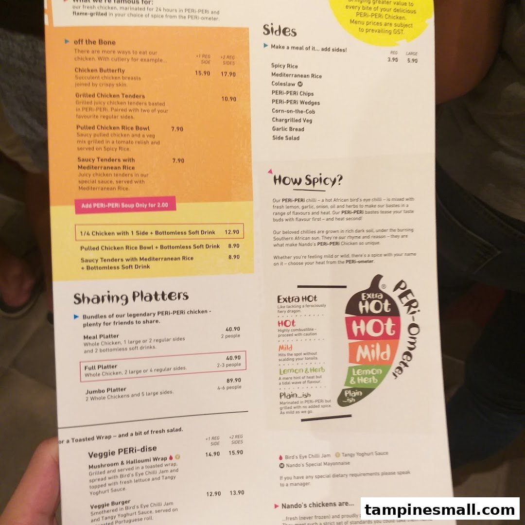 A detailed view of the Nando's menu, showcasing chicken, sides, platters, and spice levels.