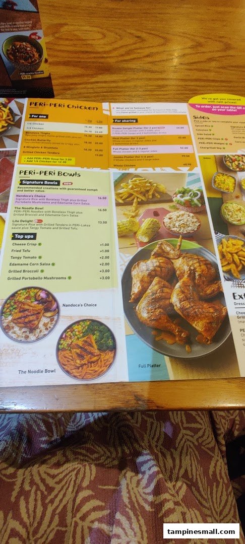 A detailed Nando's menu displaying PERi-PERi chicken, bowls, platters, and sides with prices.