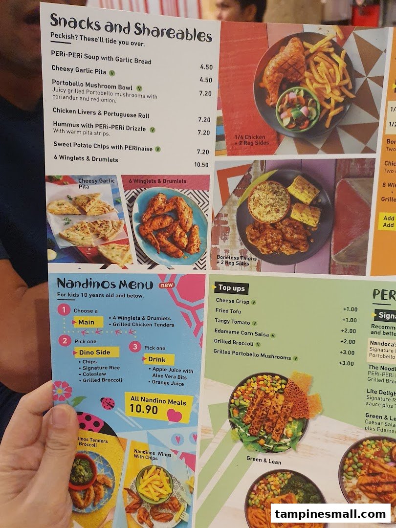 A close-up view of the Nandos menu, featuring snacks, shareables, and kids' meals.