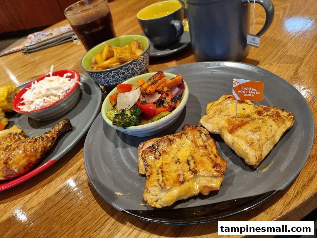 A delicious Nando's meal featuring flame-grilled chicken, sides, and drinks on a wooden table.