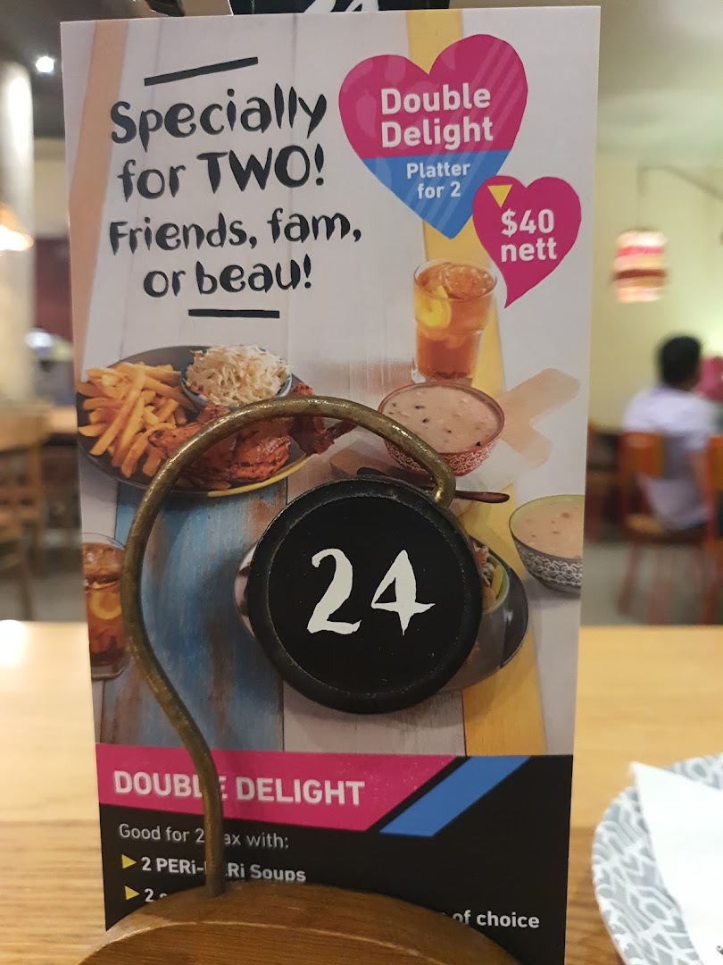 A Nando's table tent advertising a 'Double Delight' platter for two, priced at $40 nett.