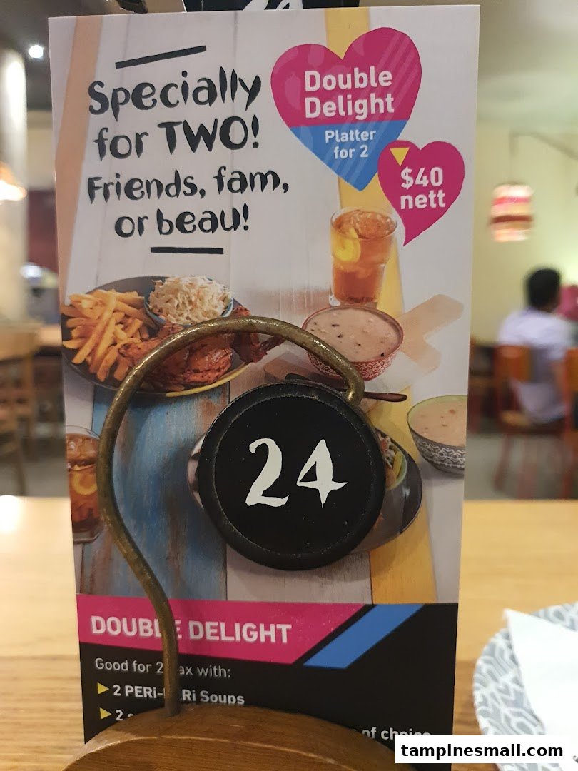 A Nando's table tent advertising a 'Double Delight' platter for two, priced at $40 nett.