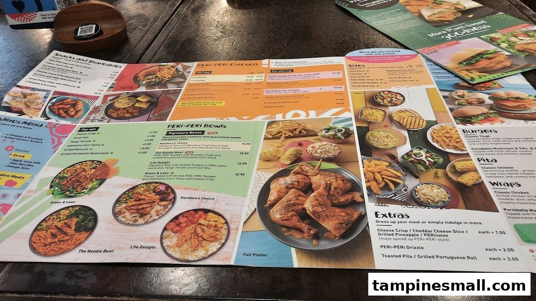 A detailed Nando's menu displaying various PERi-PERi chicken dishes, bowls, sides, and more.