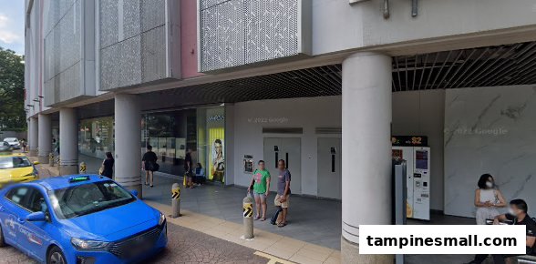 Street view of a modern building with the Kiyomi Party and Mobile shop entrance, people, and a taxi.