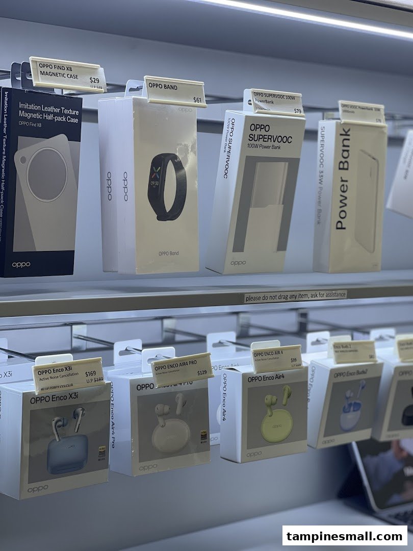 A close-up view of various OPPO mobile accessories and audio devices displayed in a retail store.