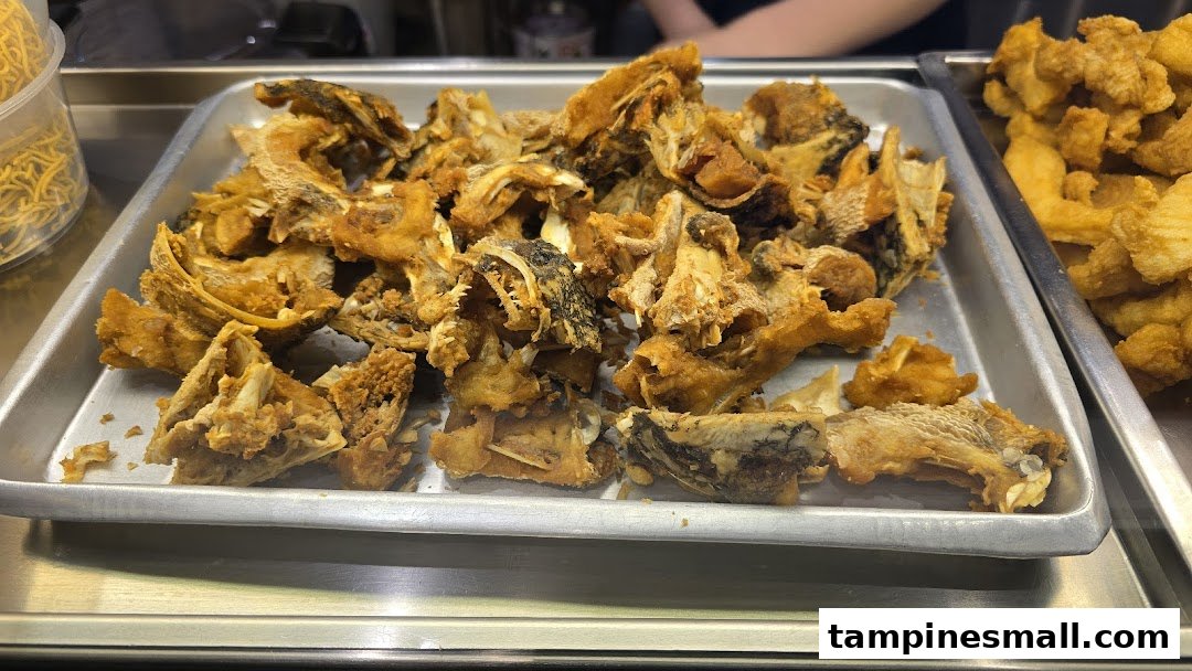 A tray filled with crispy fried fish bones and skin, ready for a delicious fish soup.