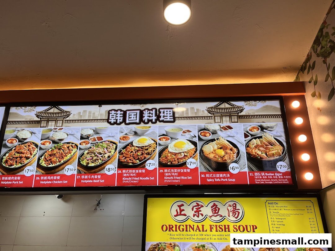 A brightly lit menu board displaying Korean hotplate dishes, soups, and an 'Original Fish Soup' add-on list.