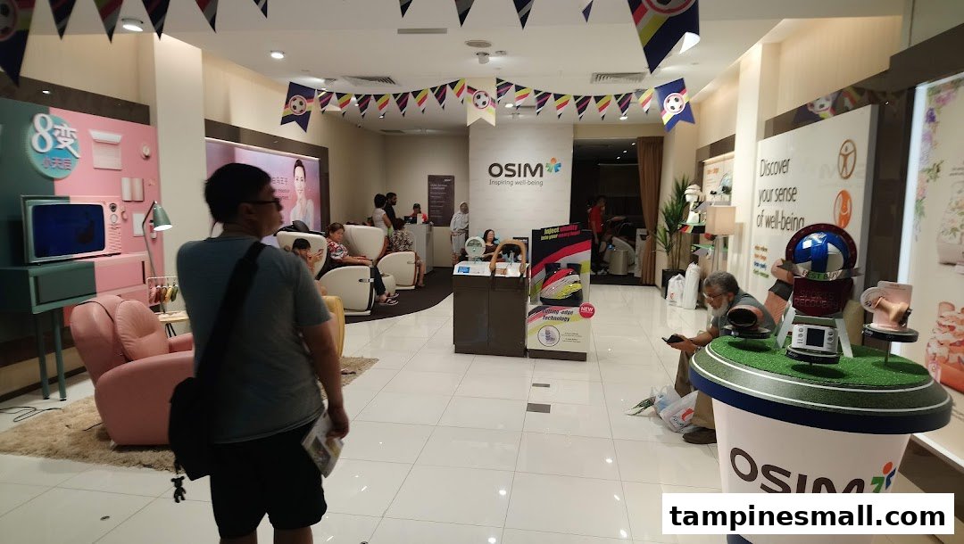Interior view of OSIM Tampines Mall, showcasing customers trying out massage chairs and wellness products.