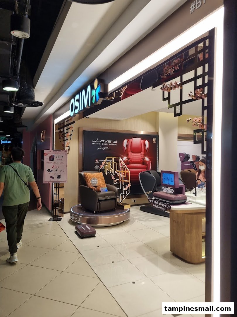 The OSIM shop entrance featuring massage chairs and wellness products, with a shopper walking past.