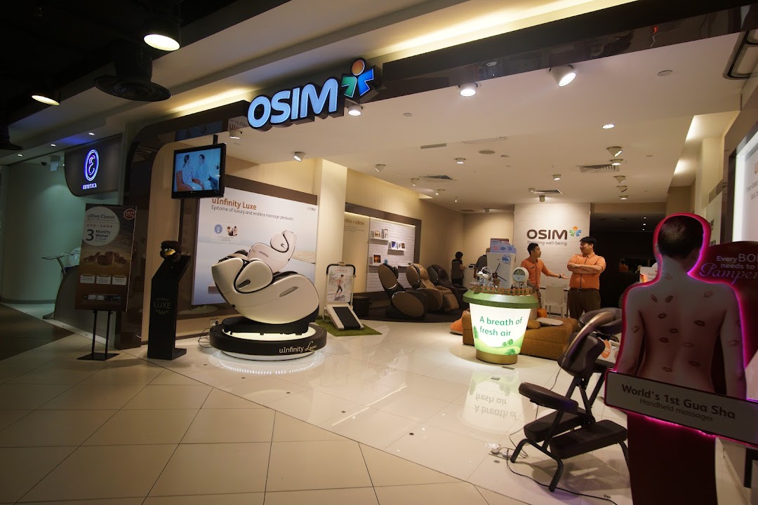 The OSIM store entrance showcases various massage chairs and wellness products, inviting customers to experience relaxation.
