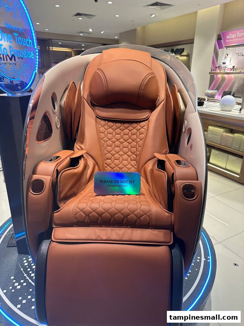 A luxurious brown OSIM massage chair display with a 'DO NOT SIT' sign in a retail store.