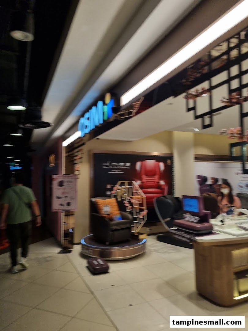 The OSIM shop front at Tampines Mall, showcasing massage chairs and wellness products.