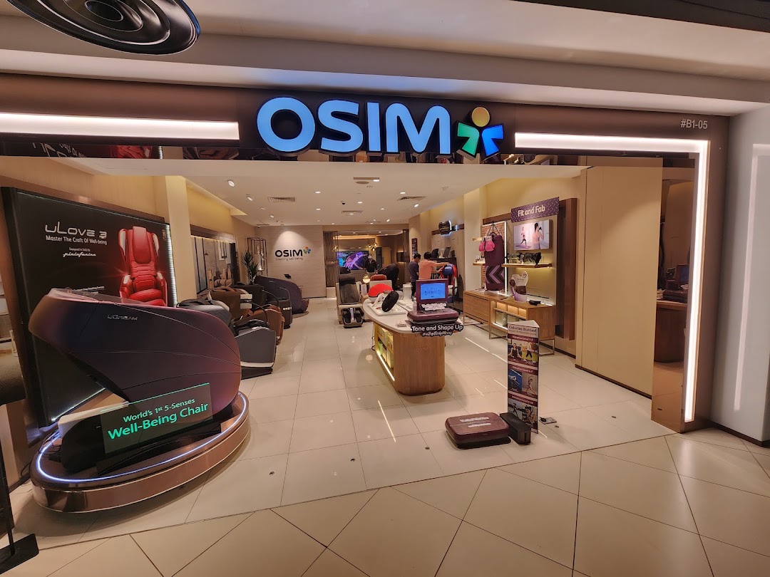 The OSIM shop entrance showcases various massage chairs and wellness products in a brightly lit retail space.