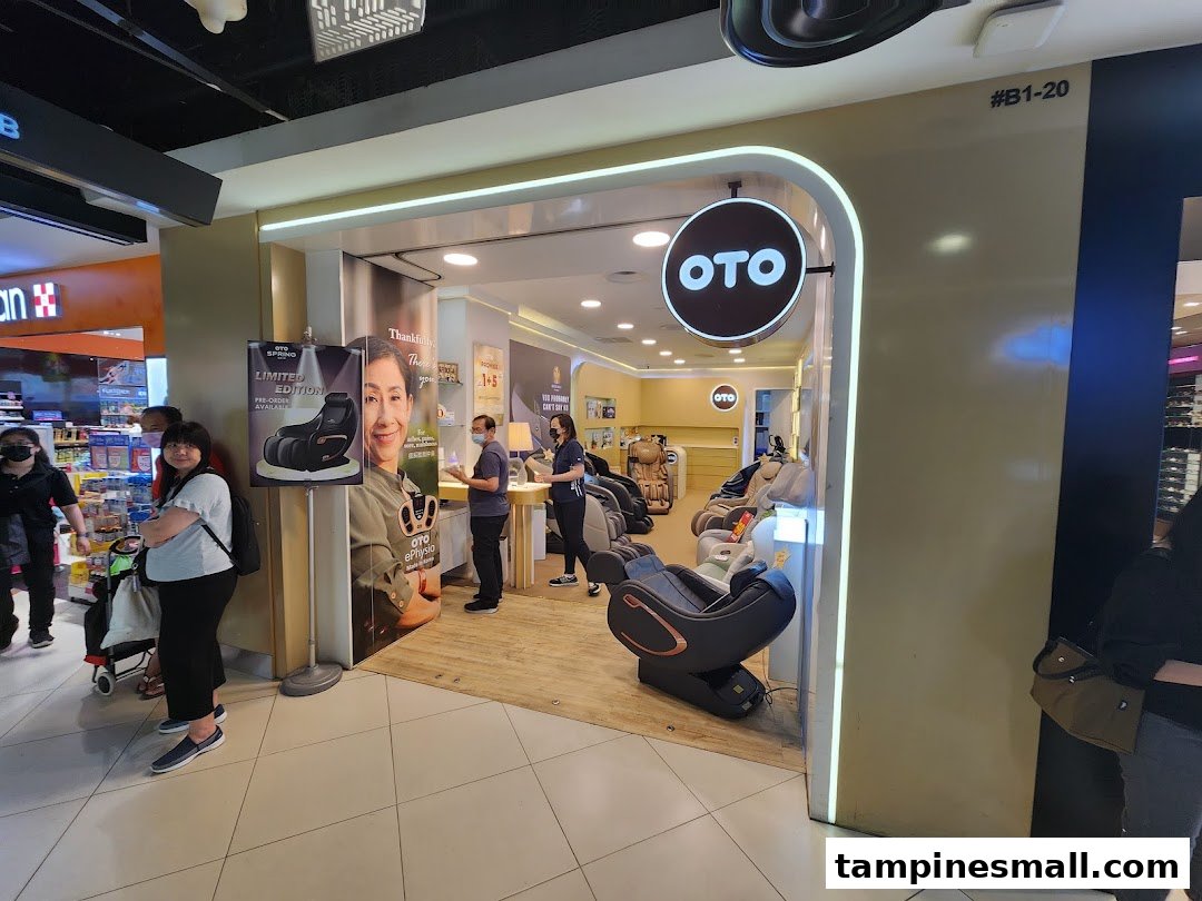 An OTO Wellness shop interior featuring various massage chairs, staff, and promotional displays.
