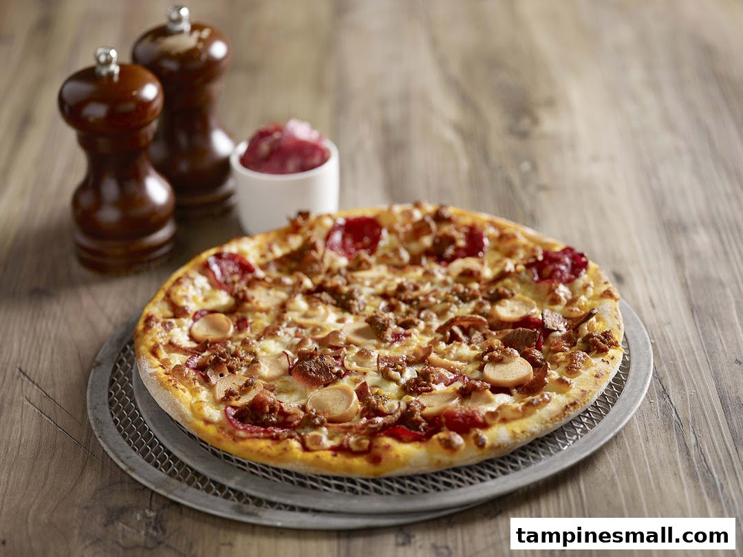 A delicious, fully loaded pizza with various toppings on a wooden table.