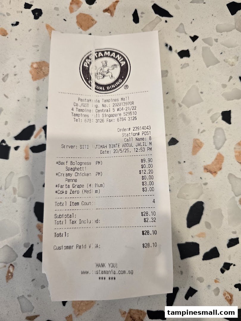A close-up of a PastaMania receipt showing purchased pasta dishes and drinks.
