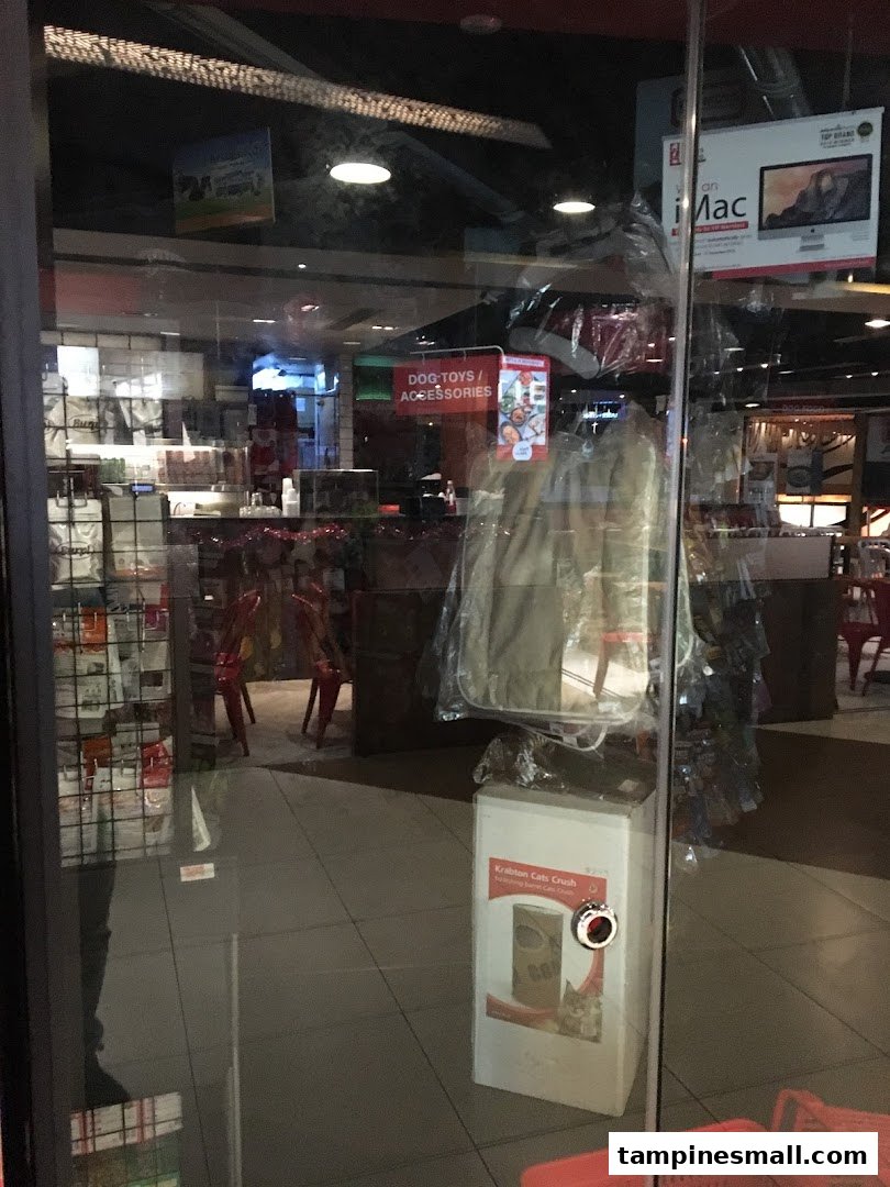 View through the glass entrance of Pet Lovers Centre, showcasing pet products and accessories inside.